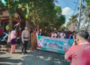 Bhabinkamtibmas Desa Tibusisok Polsek Janapria Kawal Karnaval Meriah di Janapria