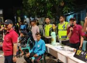BHABINKAMTIBMAS MENALA AMANKAN PERTANDINGAN BOLA VOLI DI LAPANGAN GOTONG ROYONG