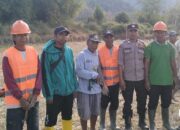 Bhabinkamtibmas Polsek Woha Hadiri peletakan batu pertama program percepatan peningkatan Tata Guna Air Irigasi (P3-TGAI).