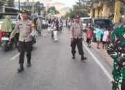 Personel Polsek Woha Menggelar Pengamanan dan Pengawalan Pawai Ta’aruf Pembukaan MTQ Tingkat Kecamatan Woha ke-58